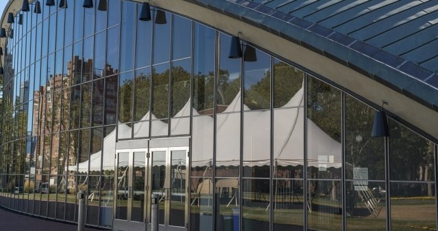 Kresge Auditorium with event tent reflected in glass